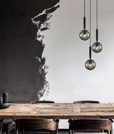 TRATTINO: Interior Bronze Amber /Black Smoke Spherical Glass Multiple Round Base Pendant Lights